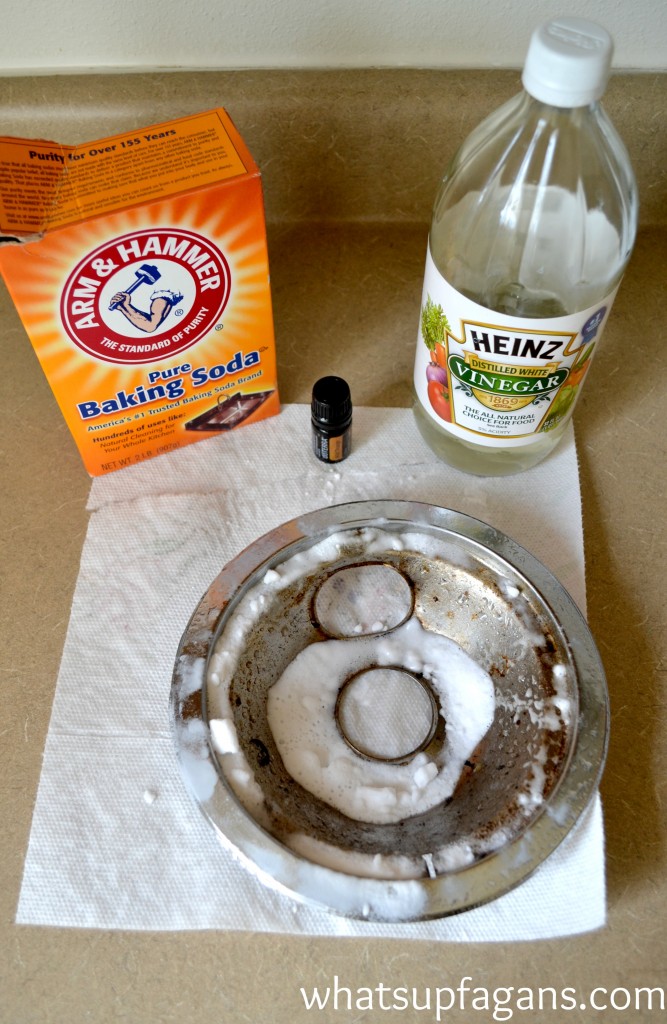 Clean a burner pan with baking soda and vinegar and essential oils