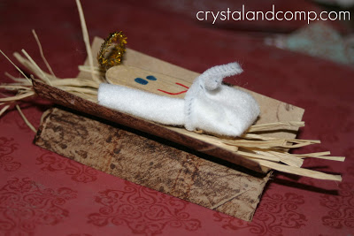 popsicle stick baby Jesus nativity craft of manger and Jesus