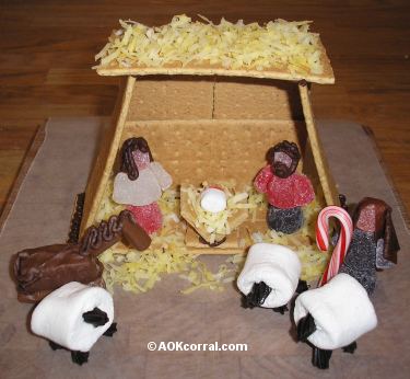 edible nativity scene craft using marshmallows, graham cracker manger, and gum drop people. 