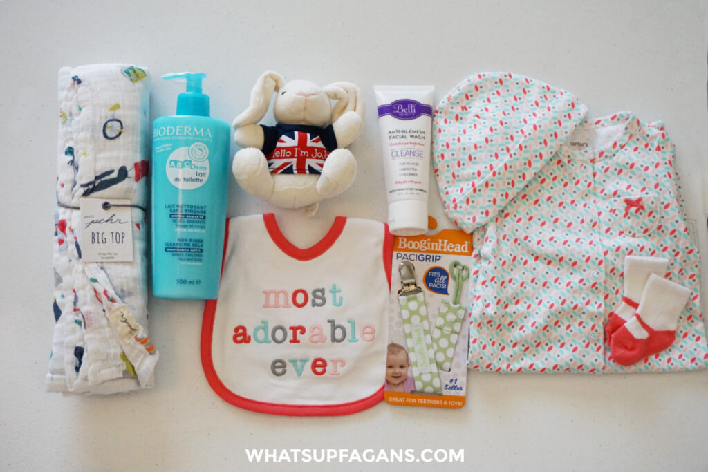 Noobie Nest Baby Box unboxed contents from July 2018 subscription box for babies. Swaddle, baby wash, outfit, face wash