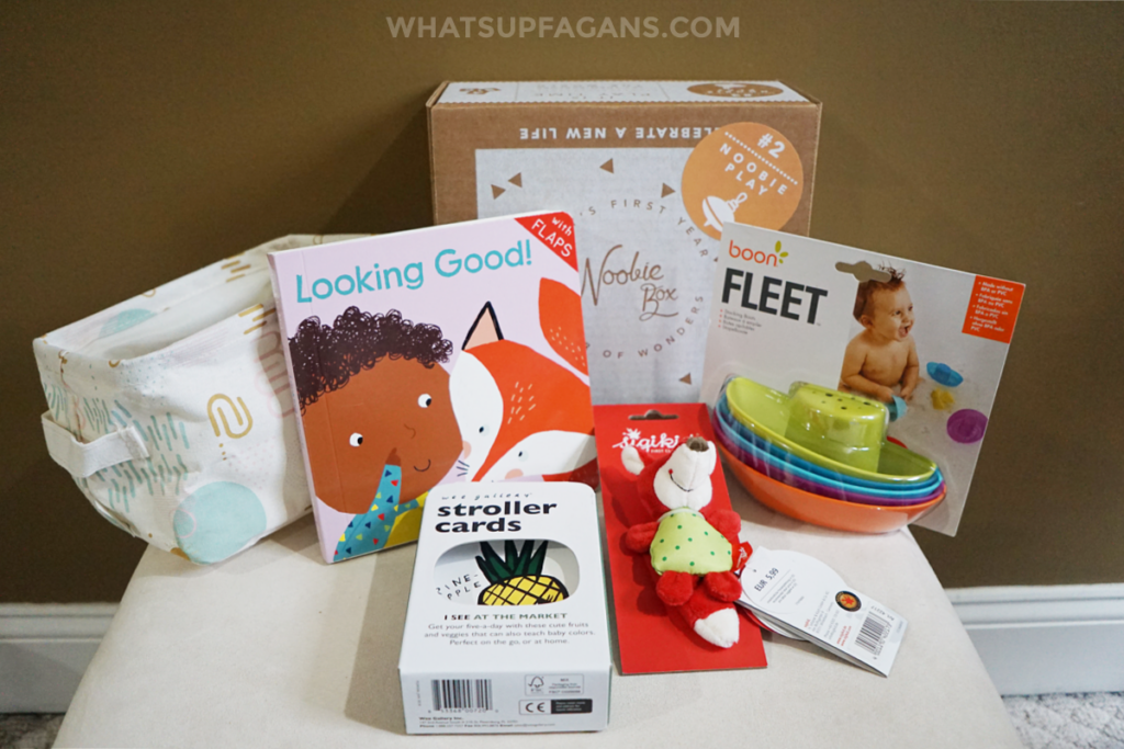 Inside look at the what comes in the Noobie Play box in 2021 - book, bath toys, rattle, stroller flash cards